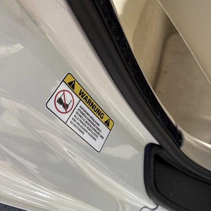 STICKER WARNING – Remove tight clothing DE